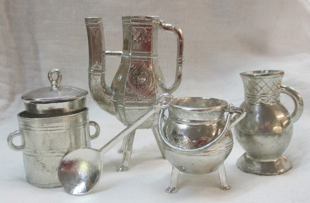 Hollow toy vessels with the miniature spoon