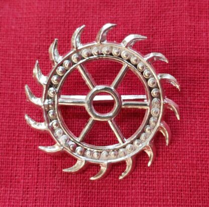 Pilgrim sign of St. Catherine of Alexandria, a spiked wheel