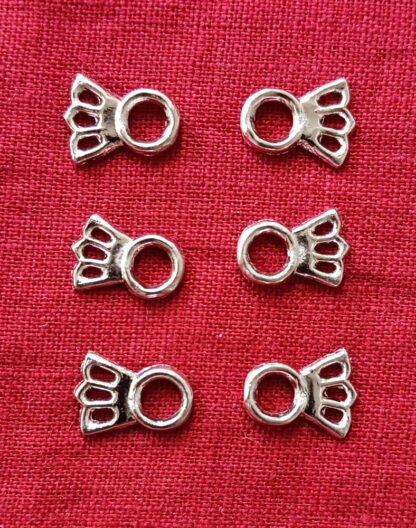 Three pairs of Comet Lacing Eyelets.