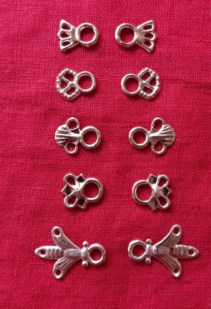 Pairs of lacing eyelets: comet, filigree, shell, pointy, and bee